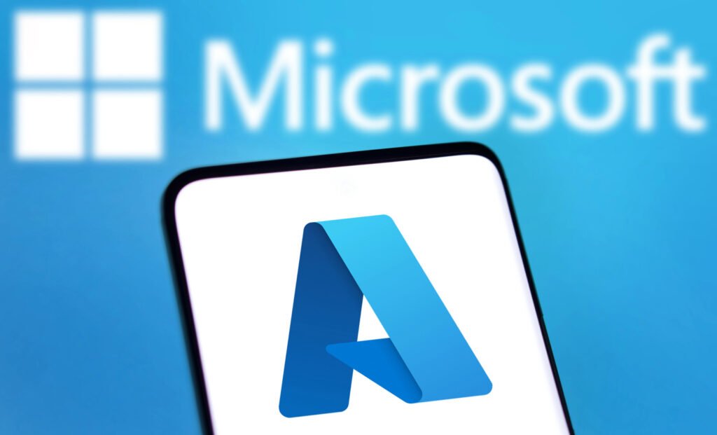 Close-up of a smartphone displaying the Microsoft Azure logo, highlighting its robust cloud services, with a blurred background featuring the Microsoft logo.